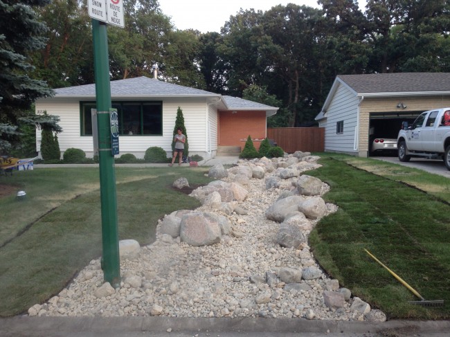 Landscaping Challenges in Winnipeg? Dry Stream Bed Grading Solution