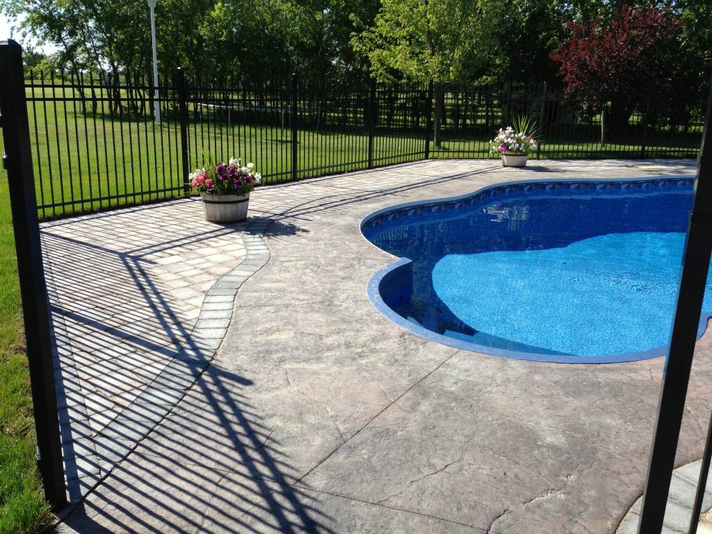 Ornamental Fence and Pavers Around Pool