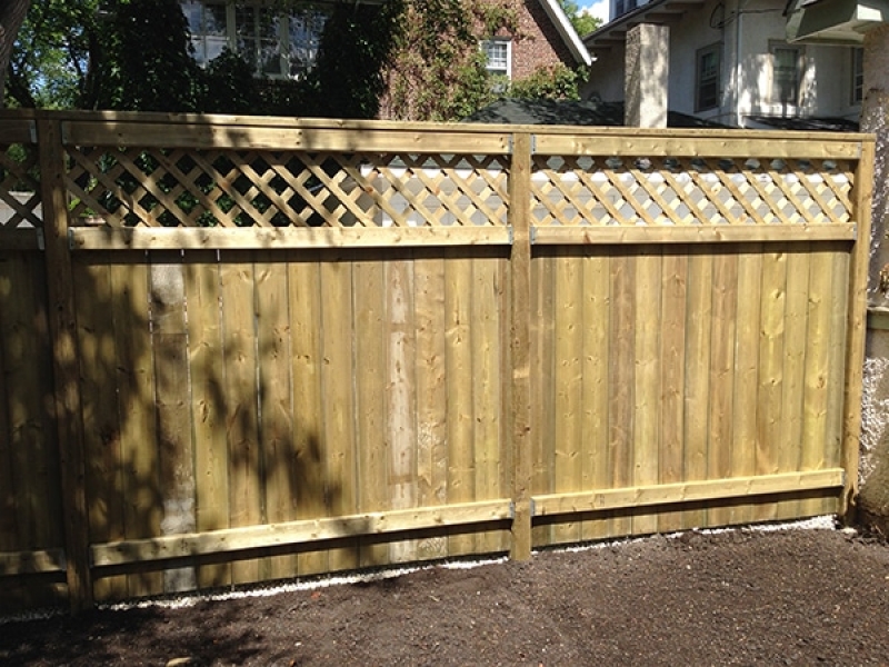 Treated green deck and fence with Holland paving stone patio in Antique Brown (AOW)