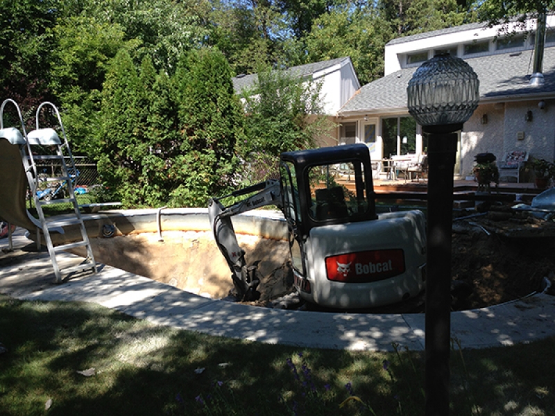 Swimming pool removal with large machine access