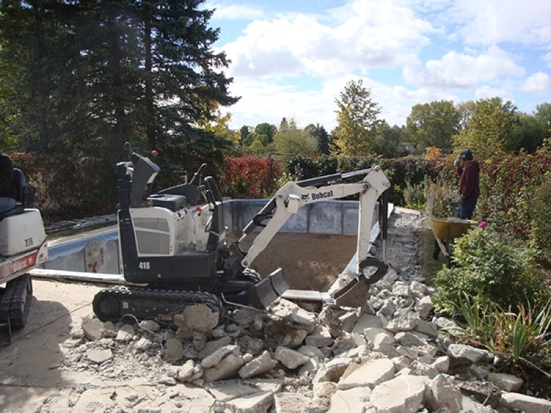 Swimming pool removal with access only for small machines (30 inches) and wheelbarrows.