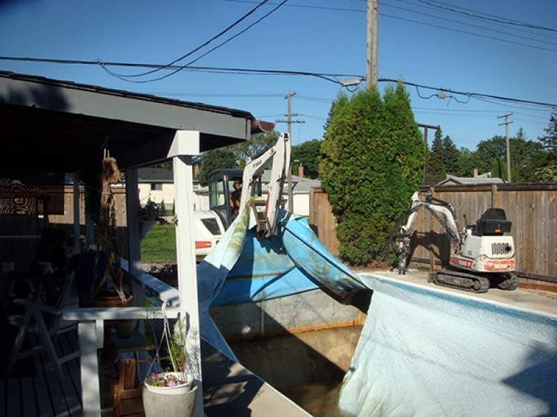 Swimming pool removal with access directly off back lane.