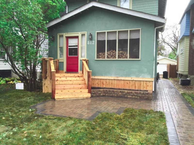 Piles under existing front porch, front steps, porch skirt, walk and front patio