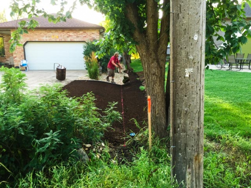 Drainage swale along property line