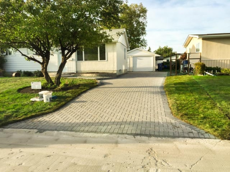 Driveway, patio, front walk, and stairs with Holland paving stones and Stack Stone retaining wall bricks