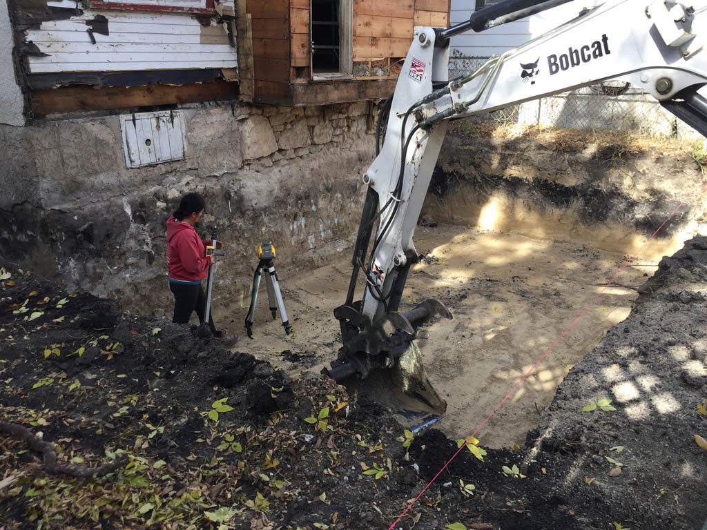 Excavation and prep work for basement expansion and garage pad