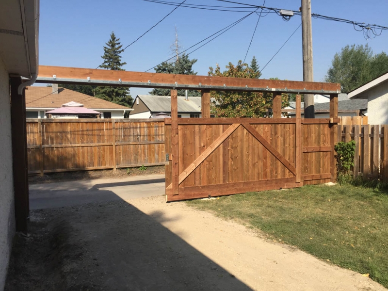 Treated brown sliding vehicle gate