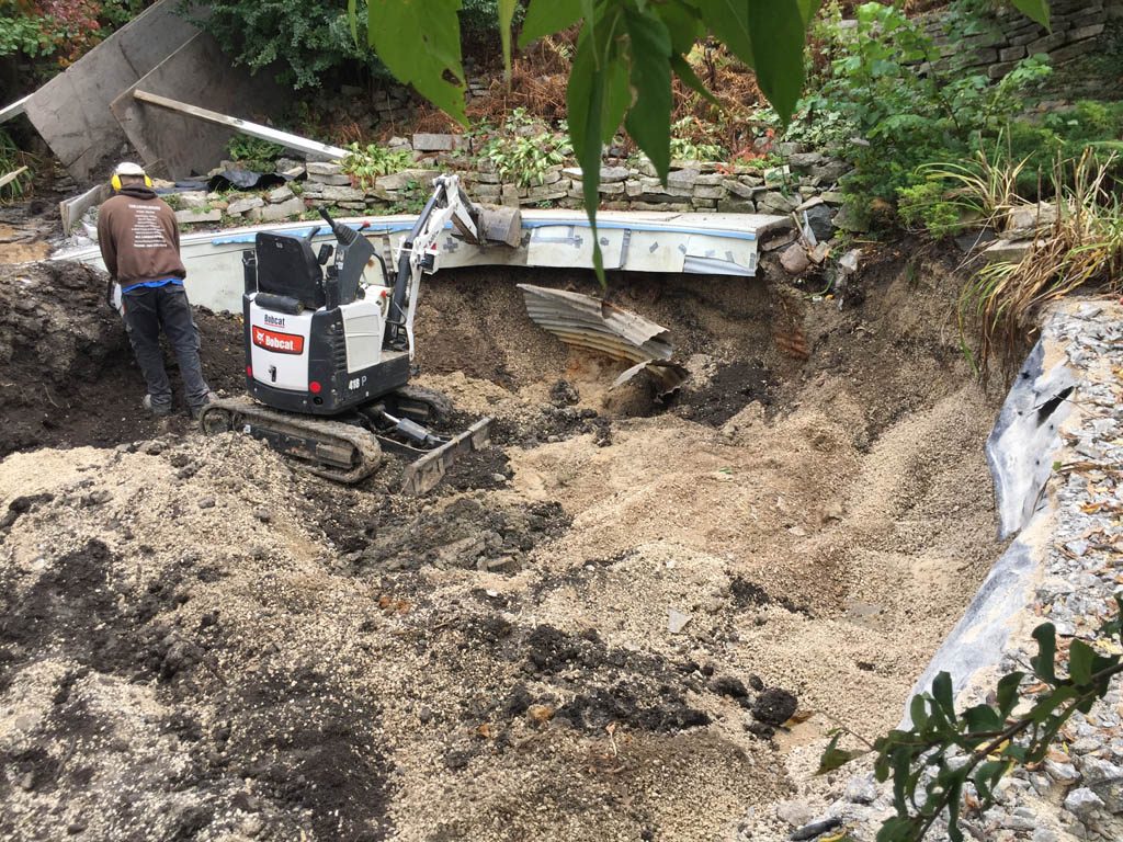 Pool removal from riverbank yard with small machine access only