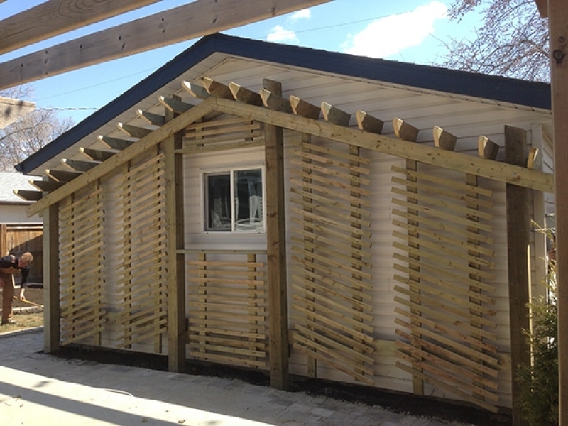 Custom privacy wall, patio extension, retaining wall beside driveway