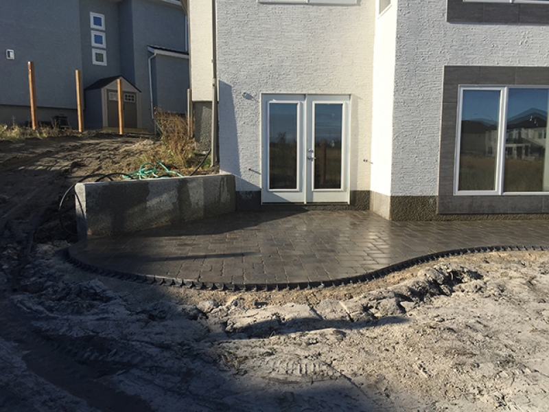 Roman paving stone patio at walk-out basement