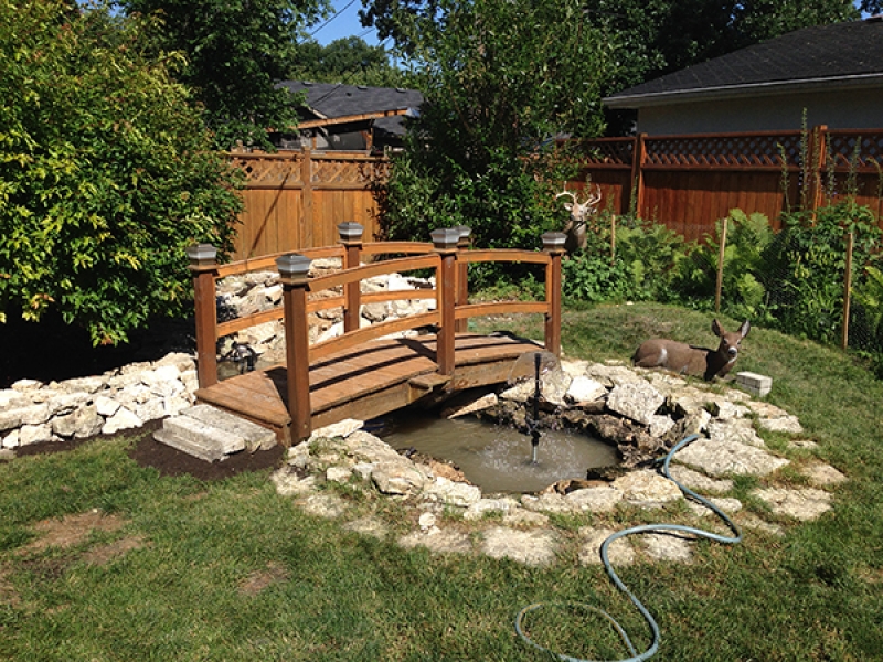 Re-installation of existing waterfall, stream and pond