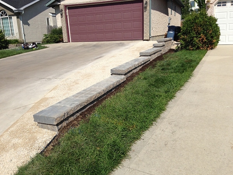 Pisa II retaining wall in Sierra Grey and crushed limestone to widen driveway