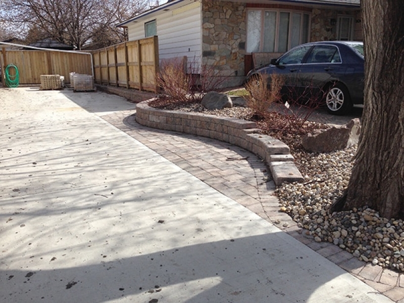 Custom privacy wall, patio extension, retaining wall beside driveway