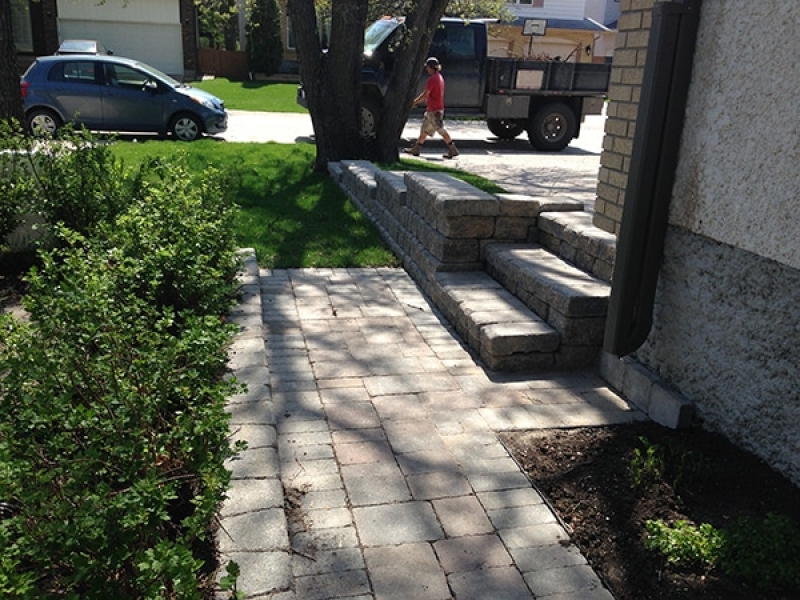 Natural wood mulch, sod, shed with Hardi-board siding, composite deck