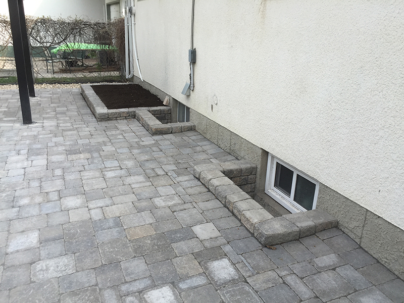 Roman paver patio and window wells