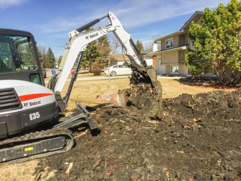 Stump removal with excavator