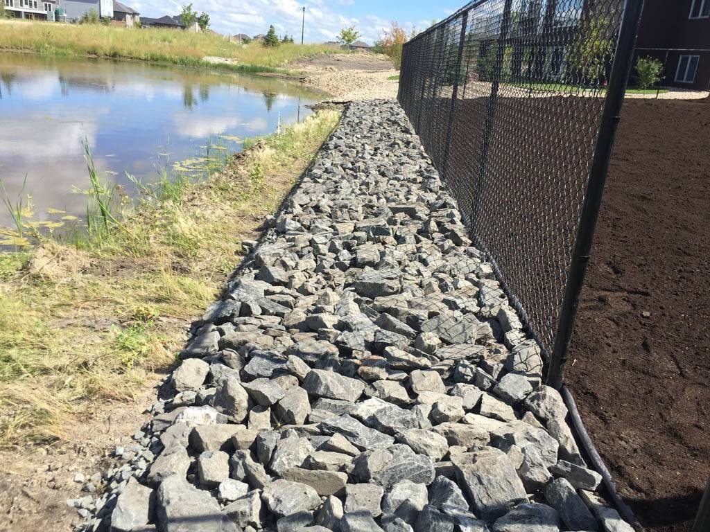 4-8 inch black granite along lake edge (rock gardens)