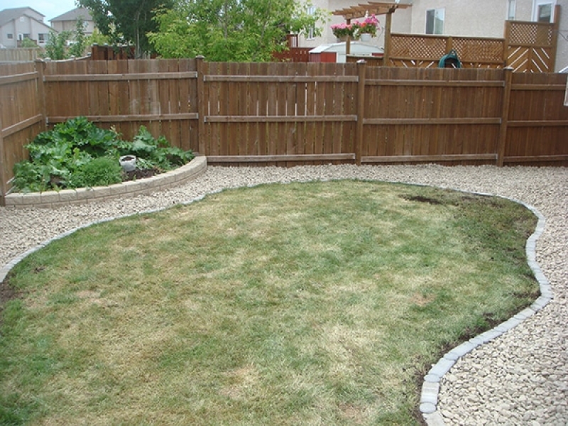 Crushed stone separated from existing lawn by I con edger