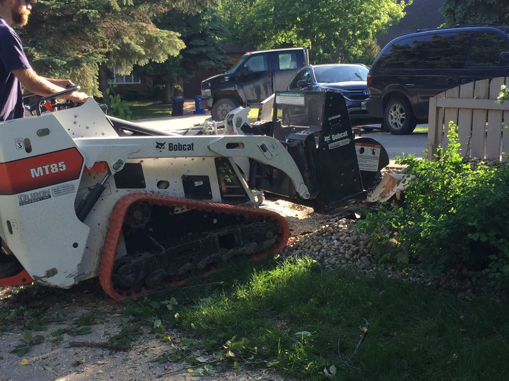 Stump grinding with mini skid steer