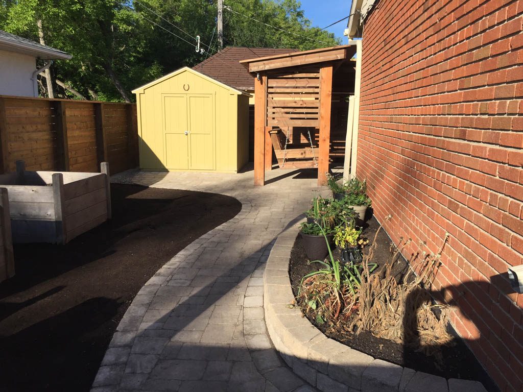 Treated brown pergola with hanging bench, fixed bench, Roman paving stones, planter with trellis, etc