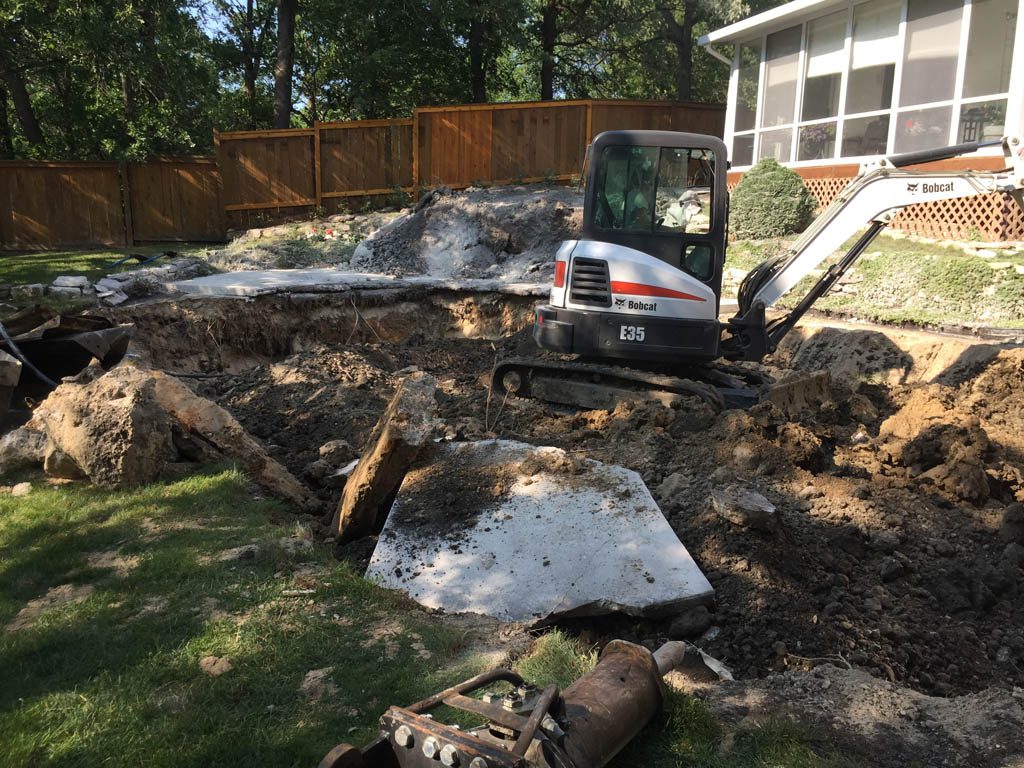 Swimming pool removal from riverbank yard