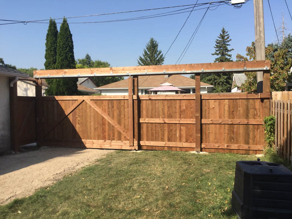 Treated brown sliding vehicle gate