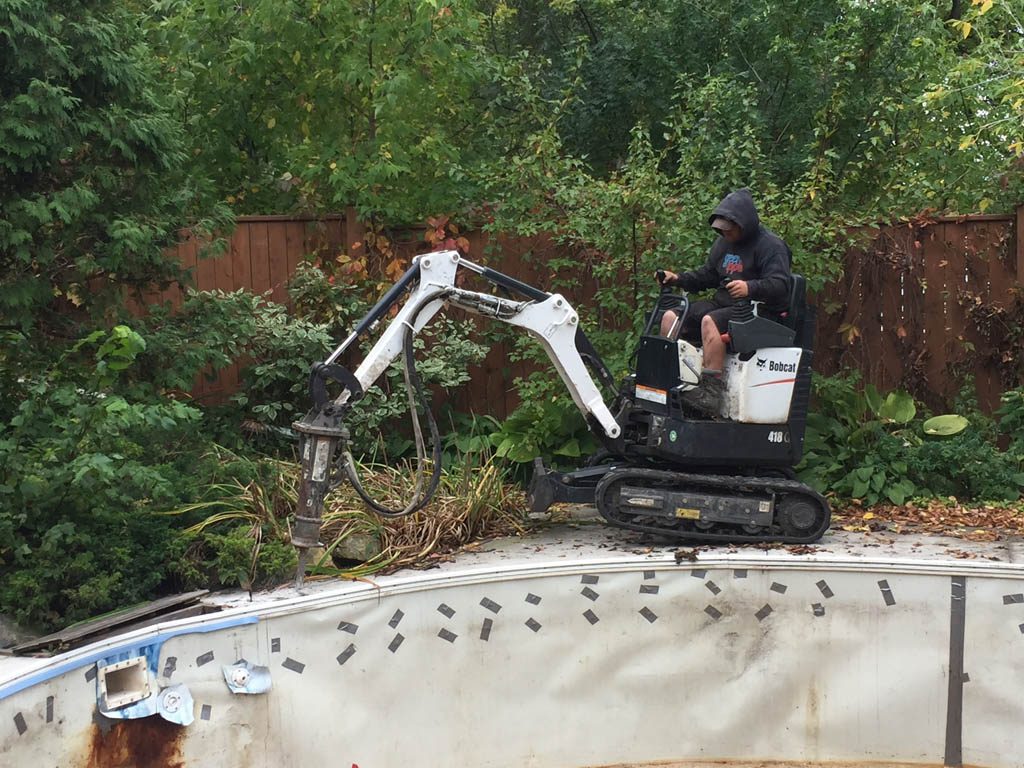 Pool removal from riverbank yard with small machine access only