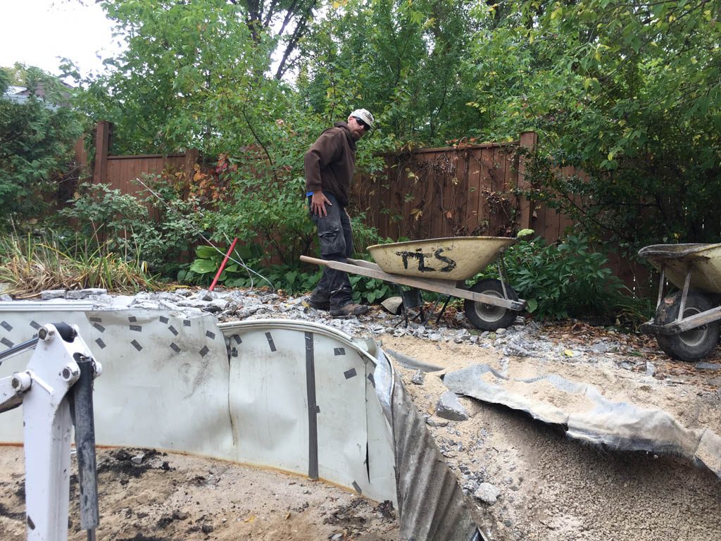 Pool removal from riverbank yard with small machine access only