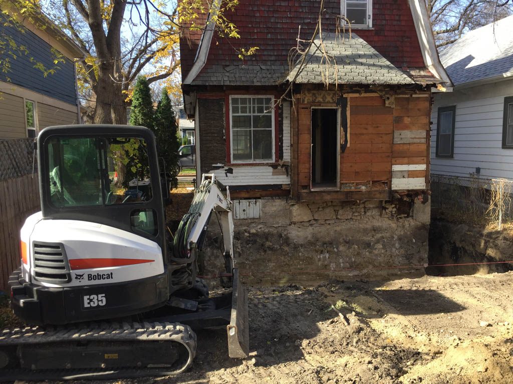 Excavation and prep work for basement expansion and garage pad