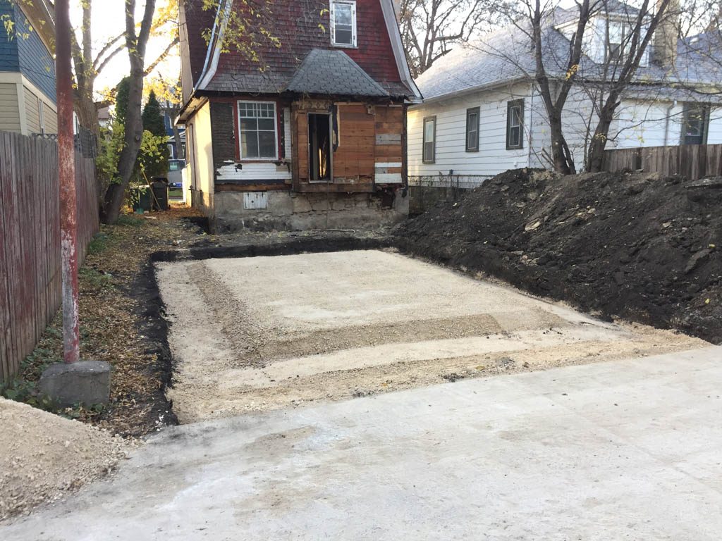 Excavation and prep work for basement expansion and garage pad