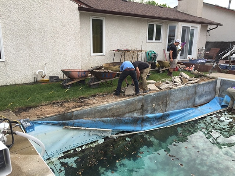 Backyard pool removal with mini excavators