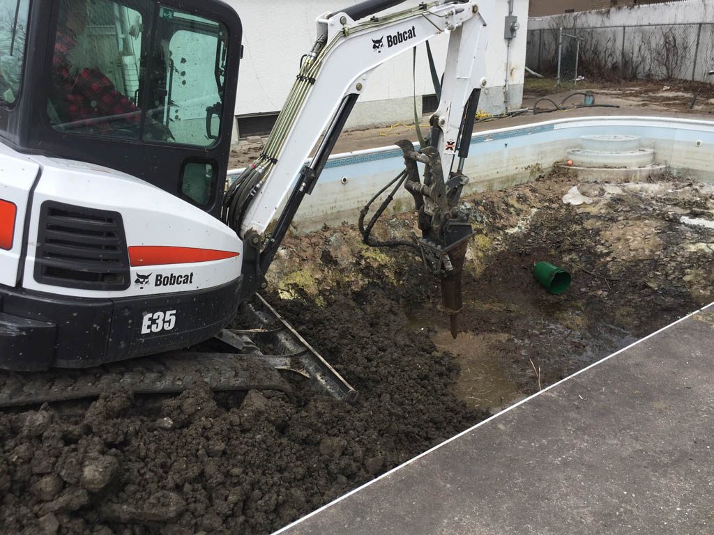 Pool removal with concrete walls and floor