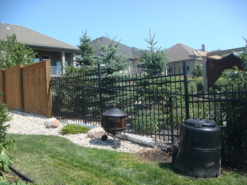 5 foot black ornamental fencing and 6 foot treated brown fencing with 6x6 posts