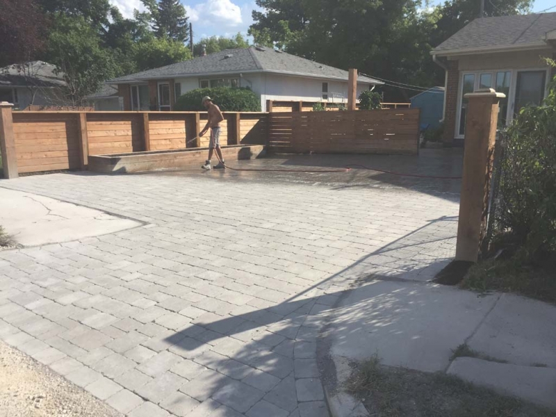 Driveway with Roman Paving Stones and Wooden Planter