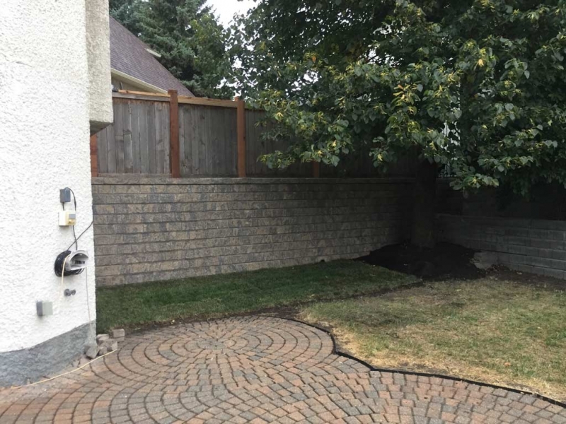 Roman Pisa Retaining Wall with Weeping Tile and Geogrid Reinforcement