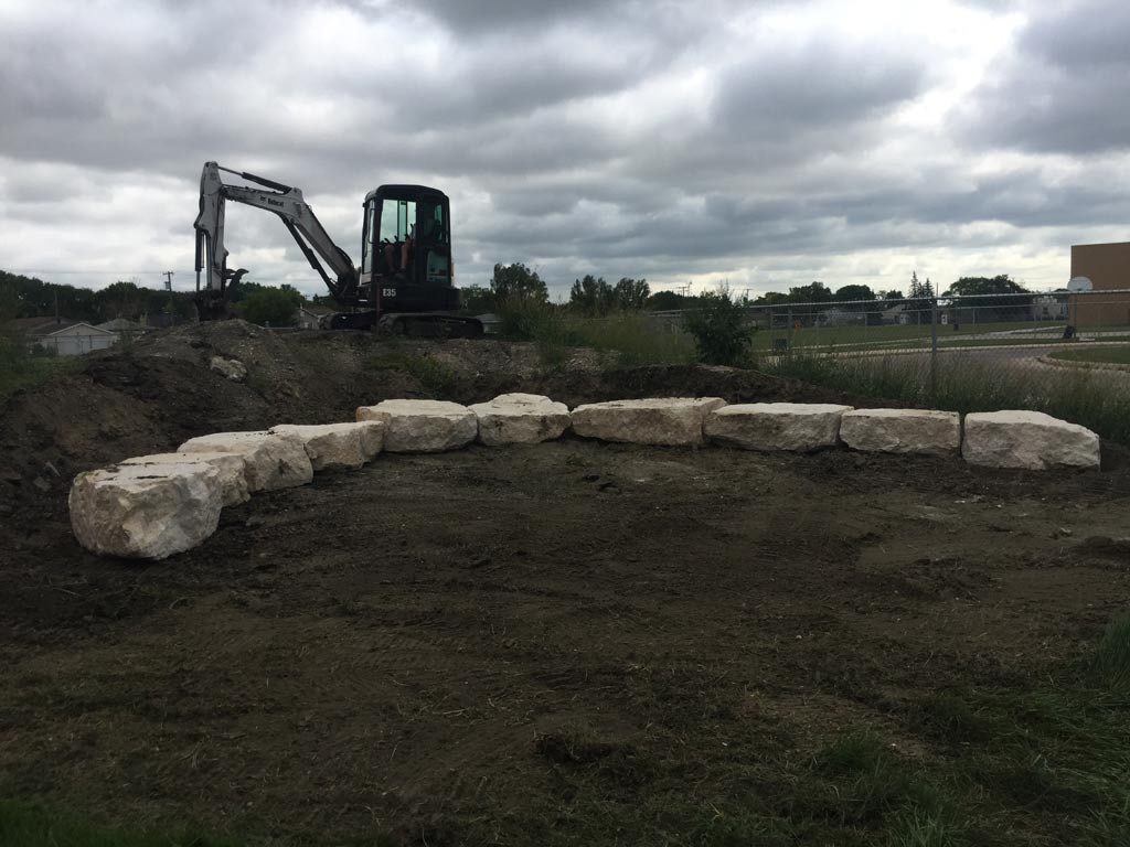 Outdoor Classroom Tiered Retaining Wall Seating with Limestone Boulders