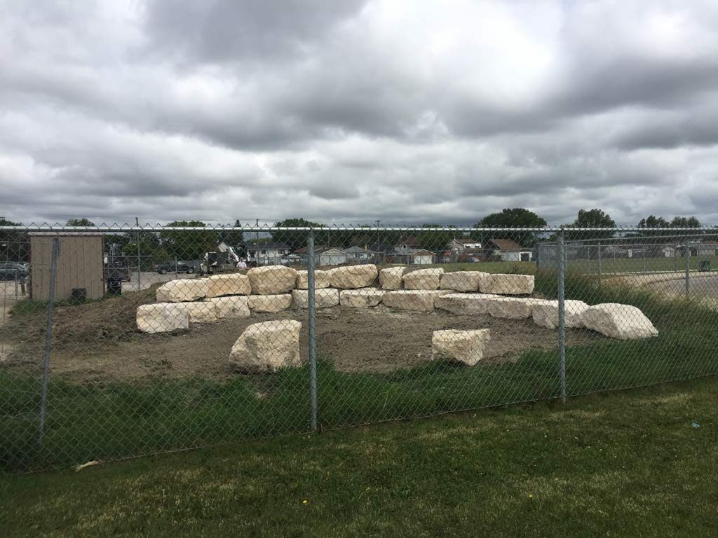 Outdoor Classroom Tiered Retaining Wall Seating with Limestone Boulders