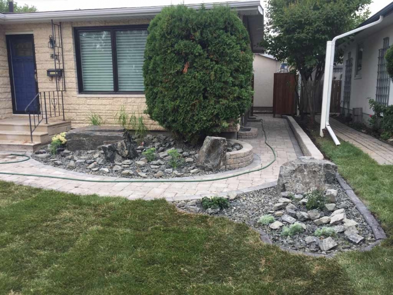 Front Yard Makeover with Roman Paver walk, Black Granite Boulders, Plants, Sod