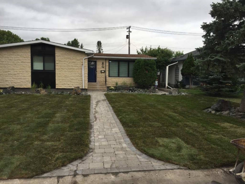 Front Yard Makeover with Roman Paver walk, Black Granite Boulders, Plants, Sod